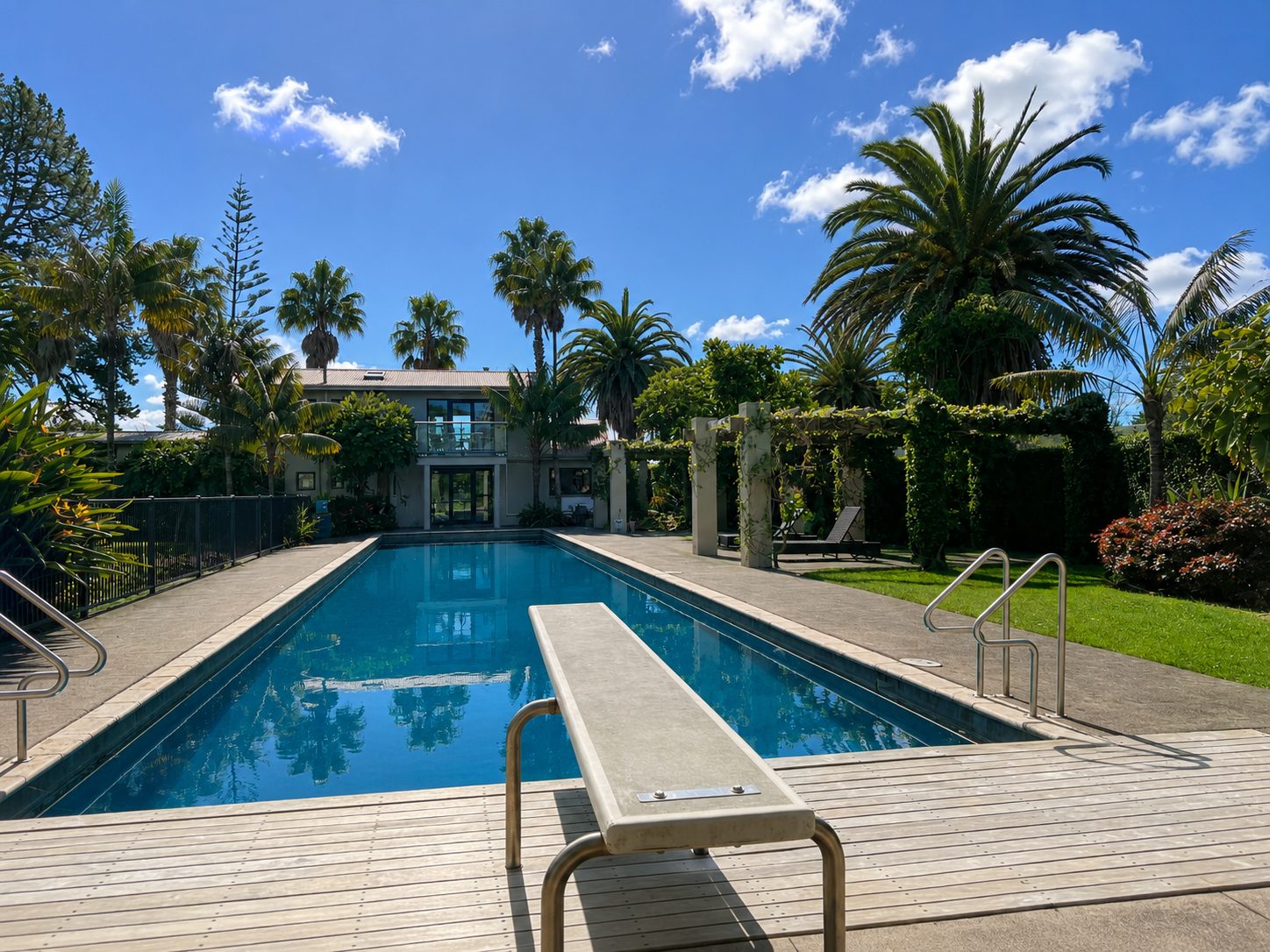The 25-metre pool with its diving board, seen from the deck